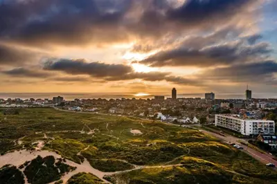 an aerial view of a city at sunset at Studio 19 with private parking in Zandvoort