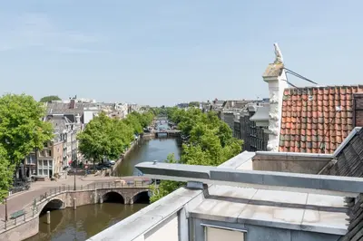 a view of a river from a building at Empire suites roof terras in Amsterdam