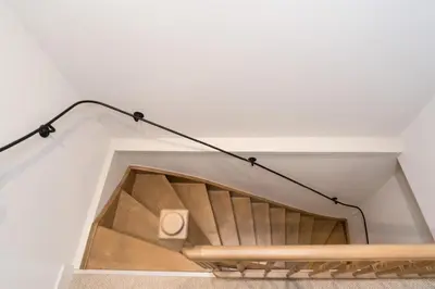 a light hanging over a staircase in a house at Empire suites roof terras in Amsterdam