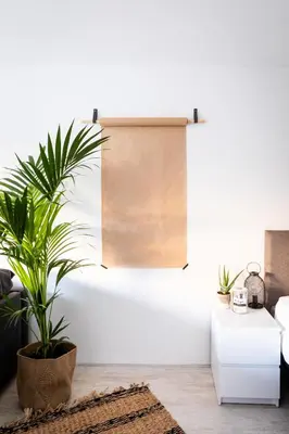 a living room with a couch and a plant at Studio Puuur in Zandvoort