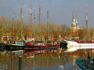 a group of boats are docked in a harbor at Holiday apartment with free parking Boven Jan Enkhuizen in Enkhuizen