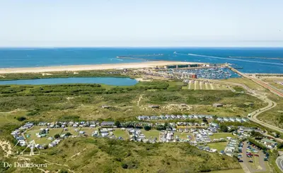an aerial view of a parking lot next to the ocean at Duindoorn 45 in IJmuiden