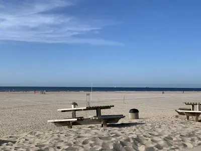 a group of picnic tables on the beach at Duindoorn 45 in IJmuiden