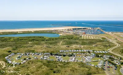 an aerial view of a parking lot next to the ocean at Duindoorn 46 in IJmuiden