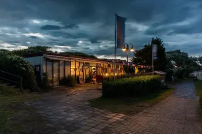 a building with a street light in front of it at Duindoorn 46 in IJmuiden