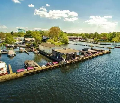 a dock with a group of boats on the water at Motor Yacht Almaz in Amsterdam