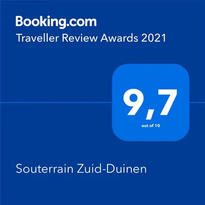a screenshot of a cell phone with the text travelling review awards at Souterrain Zuid-Duinen -Free Parking in Zandvoort