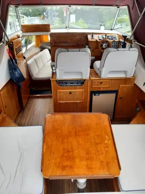 a view of the inside of a boat with a wooden table at Motor Yacht Amazone in Amsterdam