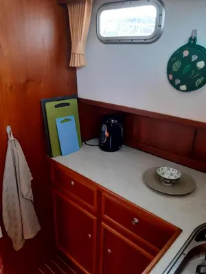 a small kitchen with a counter and a sink at Motor Yacht Amazone in Amsterdam