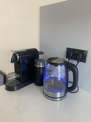 a coffee pot and a toaster on a counter at Beach Studio in Zandvoort