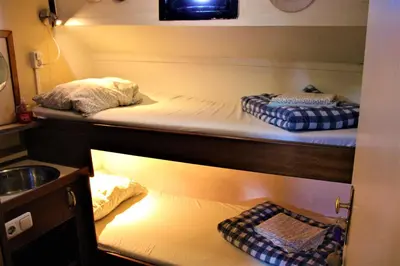 two bunk beds in a room with a sink at Amice in Haarlem
