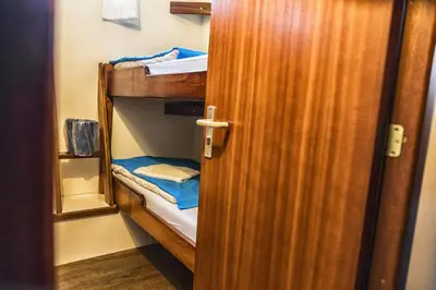 a door open to a bunk room with a bunk bed at Amice in Haarlem