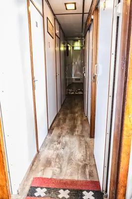 an empty hallway in an old house with a floor and a hallway at Amice in Haarlem