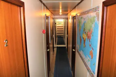 a hallway with a map of the world on the wall at Amice in Haarlem