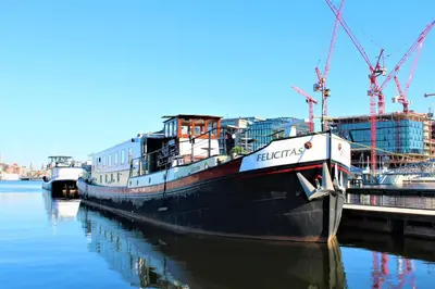 a large ship is docked at a dock at Amice in Haarlem