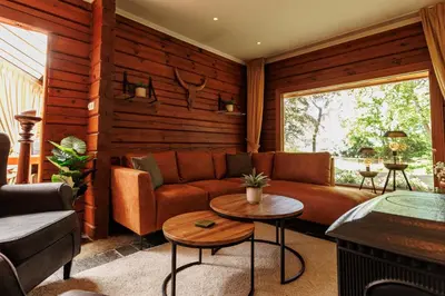 a living room with a couch and a table at 't Eekhoornnest in Soest