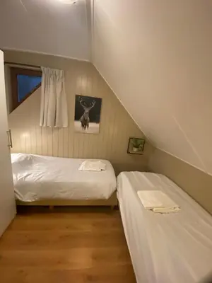 a bedroom with two beds in a attic at 't Eekhoornnest in Soest