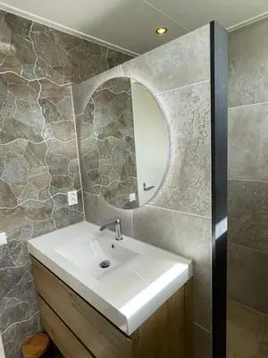 a bathroom with a sink and a mirror at Welcome by Bianca in Jisp