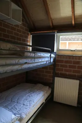a room with two bunk beds and a window at Rekerlanden 98 in Schoorldam