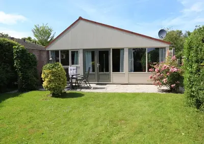 a house with a garden and a patio at Rekerlanden 98 in Schoorldam