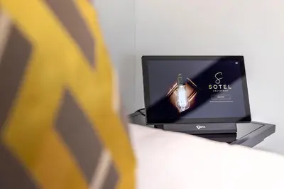 a television sitting on top of a table at Sotel Amsterdam Central Station in Amsterdam
