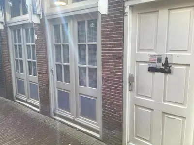 a pair of doors on the side of a brick building at B&B Alkmaars Toppunt XL in Alkmaar