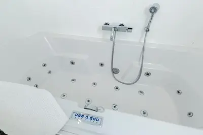 a bathroom with a shower with a scale at SEA MORE in Zandvoort