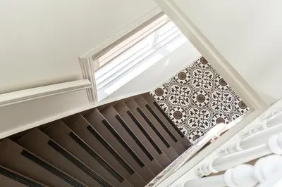 a staircase with a skylight and a window at SEA MORE in Zandvoort