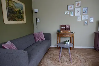 a living room with a couch and a table at Rekerlanden 257 in Schoorldam