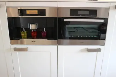 a kitchen with two ovens in a white cabinet at Lake House 74, luxury accommodation ir Sauna in Warmond