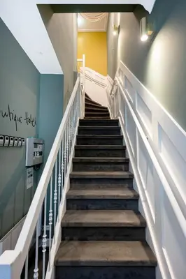 a staircase in a building with a stair case at Anegang Boutique Hotel in Haarlem