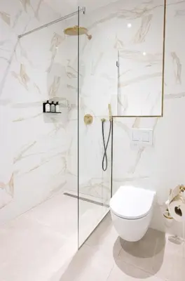 a bathroom with a glass shower and a toilet at Anegang Boutique Hotel in Haarlem
