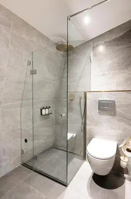 a bathroom with a glass shower with a toilet at Anegang Boutique Hotel in Haarlem
