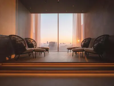 a waiting room with chairs and a large window at Van der Valk Hotel Amsterdam Zuidas-Rai in Amsterdam