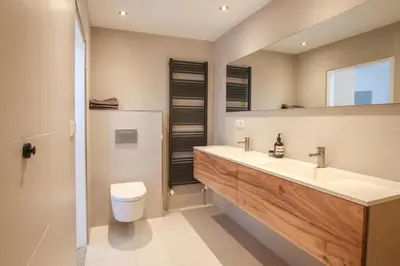 a bathroom with a sink and a toilet at Vakantiehuis Drie Dennen in Bergen
