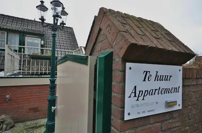 a sign on the side of a building at Westenwind in Egmond aan Zee