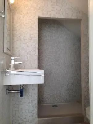 a bathroom with a white sink and a toilet at Zeeduin - fantastisch uitzicht op zee in Bergen aan Zee