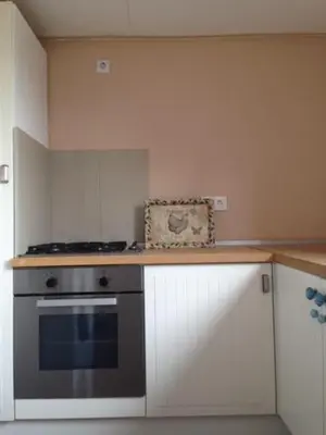 a kitchen with a stove and a counter top at Zeeduin - fantastisch uitzicht op zee in Bergen aan Zee