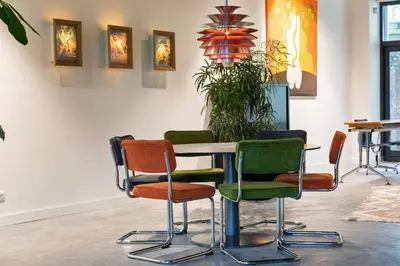 a table and chairs in a room at Parkhotel Abcoude in Abcoude