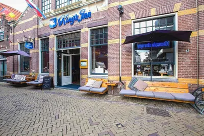 a store with couches in front of a brick building at King's Inn City Hotel Alkmaar in Alkmaar