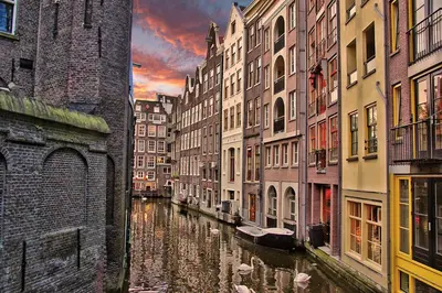 a view of a canal in a city with buildings at Leidse Square 5 star Luxury Apartment in Amsterdam