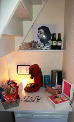 a counter with a table with food and bottles of wine at Kerstins Bed and Breakfast in Egmond aan Zee