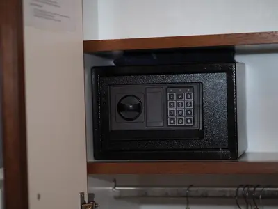 a microwave oven sitting inside of a cabinet at Hotelboat Sarah in Amsterdam