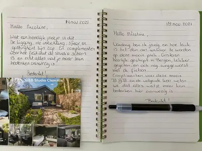 an open notebook with a pen on top at Studio Clematis Bergen in Bergen