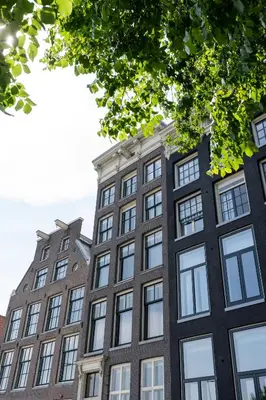 an apartment building in amsterdam with windows at Amsterdam Dockside Flats in Amsterdam