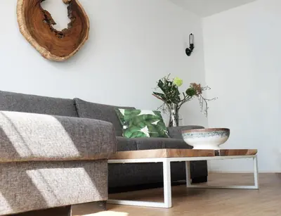 a living room with a couch and a table at Kuta Beach in Zandvoort