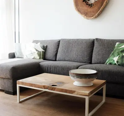 a living room with a couch and a coffee table at Kuta Beach in Zandvoort