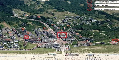 an aerial view of a town on a hill at Appartement Spoorklokken in Bergen aan Zee