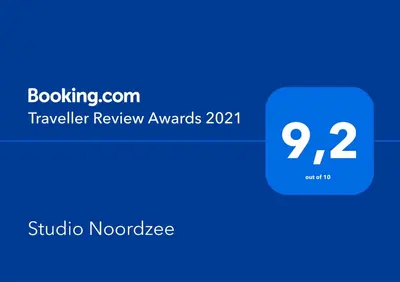 a blue box with the text traveler review awards at Studio Noordzee in Zandvoort