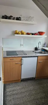 a kitchen with a sink and a counter top at Deluxe STUDIO-appartement Heemstede Zandvoort in Heemstede